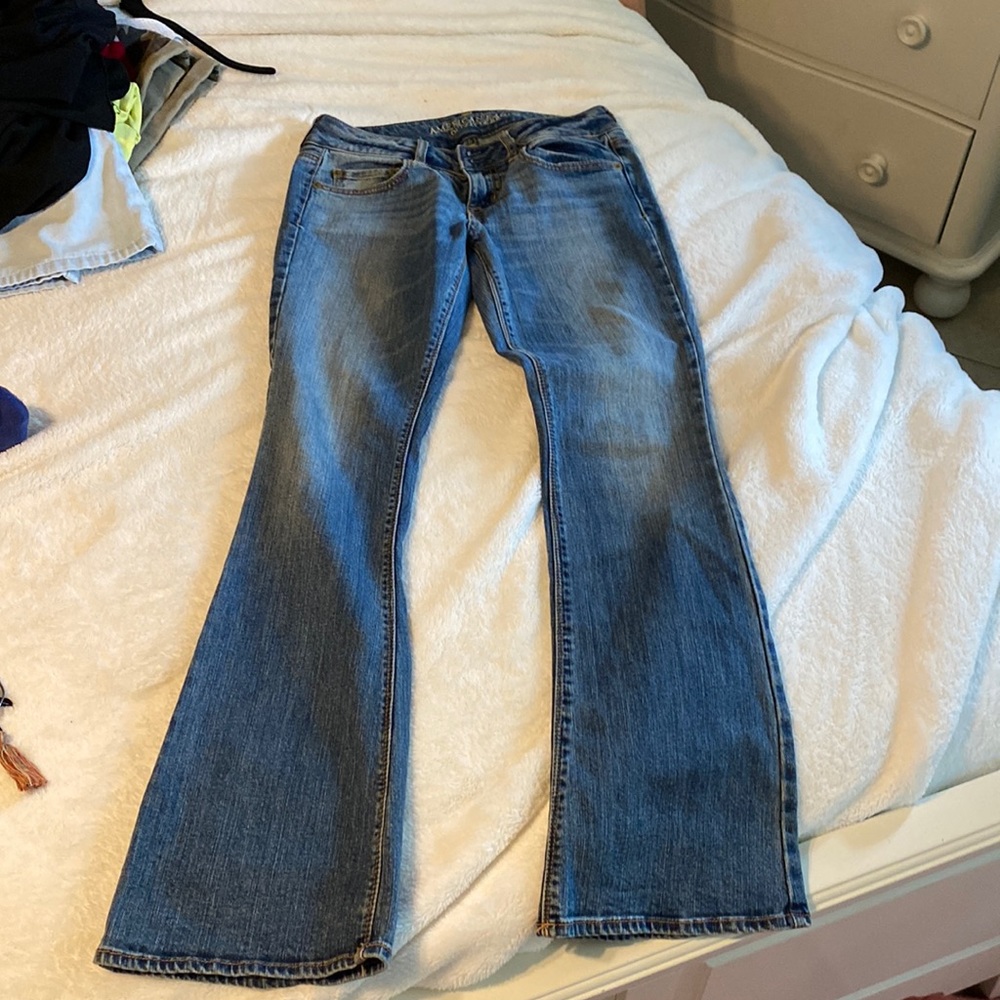 - Low rise  - medium/dark denim - boot cut/flare                - double buttons